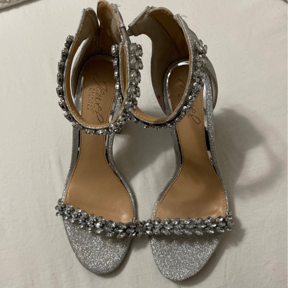 Silver glitter jeweled high heel sandals.